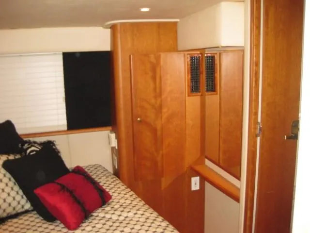 Slide: The Image of Cozy bedroom in 1999 Silverton 352 Motor Yacht with nautical-themed bedding. - 20