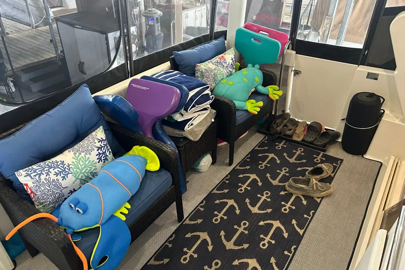 Slide: The Image of Cozy seating area on 1999 Silverton 352 Motor Yacht with nautical decor and plush toys. - 40