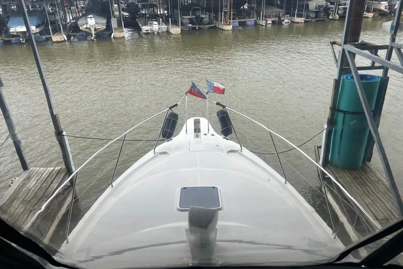 Slide: The Image of 1999 Silverton 352 Motor Yacht docked at marina, view from bow. - 45