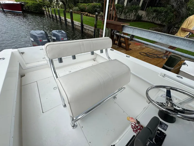 Slide: The Image of 2000 Contender 25 Open boat interior with dual engines and steering wheel. - 29