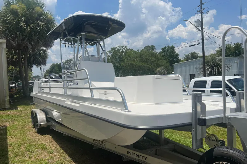 The Image of 2022 Mirage Manufacturing Bay Cat 26 boat on trailer. - 1