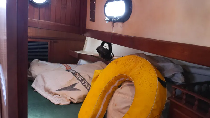 Slide: The Image of Interior of 1979 Tayana 37 sailboat with life preserver and sail bags. - 48