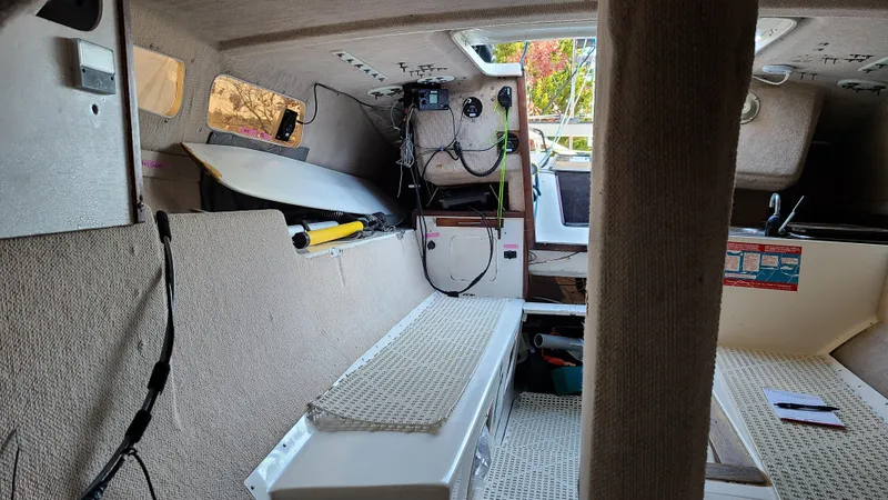 Slide: The Image of Interior of 1987 Corsair F-27 sailboat, showing cabin layout and equipment. - 14