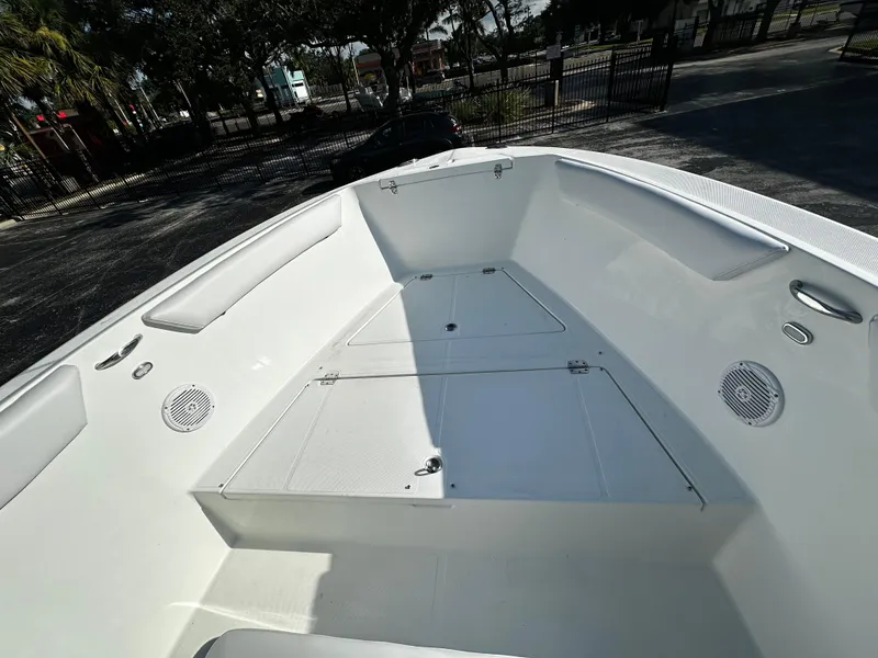 Slide: The Image of 2022 Clearwater 2300 CC boat interior with seating and storage compartments. - 5