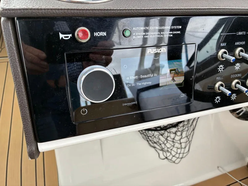 Slide: The Image of Control panel of 2021 Sea Ray SDX 290 boat with Fusion audio system. - 4