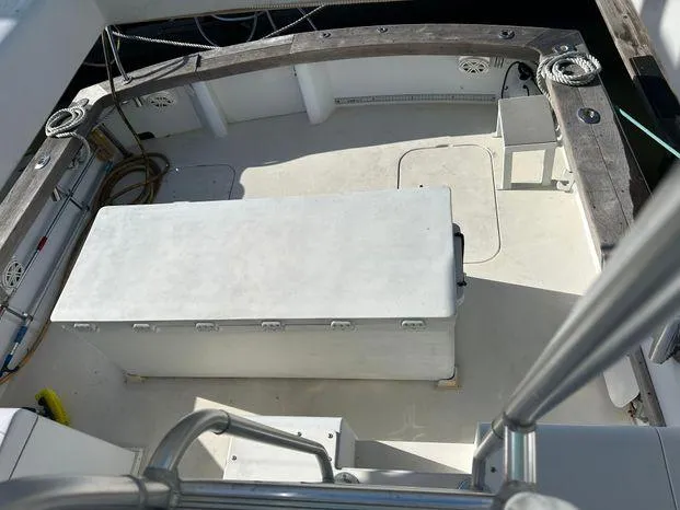 Slide: The Image of 1989 Post 43 Sport Fisherman boat deck with storage and seating area. - 14