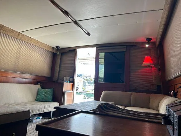 Slide: The Image of Interior of 1989 Post 43 Sport Fisherman yacht with cozy seating and ambient lighting. - 18