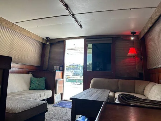 Slide: The Image of Interior of 1989 Post 43 Sport Fisherman with cozy seating and ambient lighting. - 19