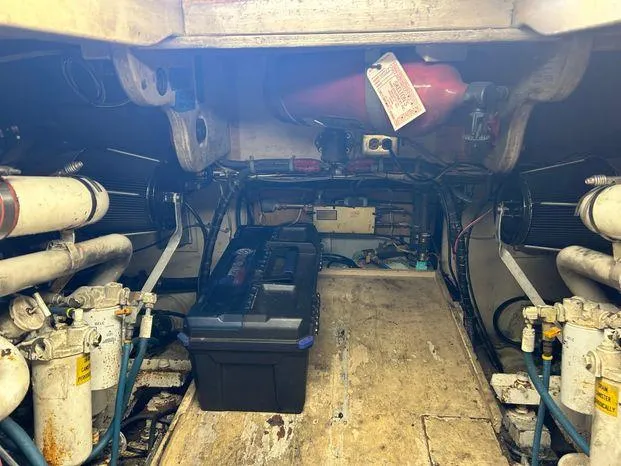 Slide: The Image of Engine room of 1989 Post 43 Sport Fisherman with tools and equipment. - 36