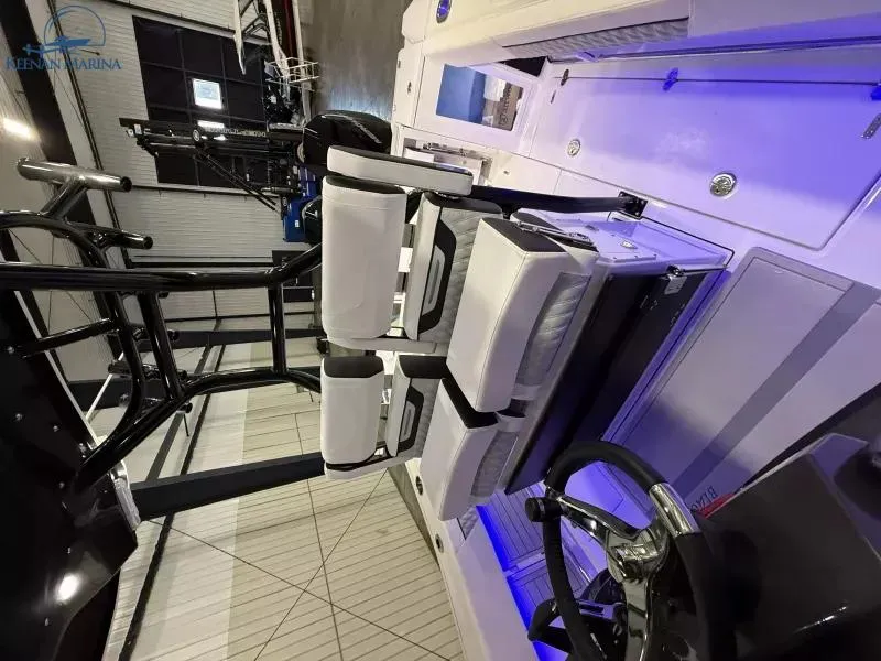 Slide: The Image of 2025 Blackfin 272CC boat interior with modern seating and steering wheel. - 7