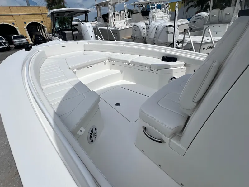 Slide: The Image of 2023 Regulator 26XO boat interior with white seating and spacious deck. - 13