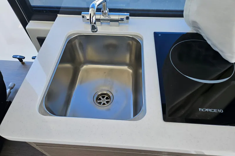 Slide: The Image of Jeanneau NC 895 Sport Series 2 kitchen sink and stove, 2026 model. - 14