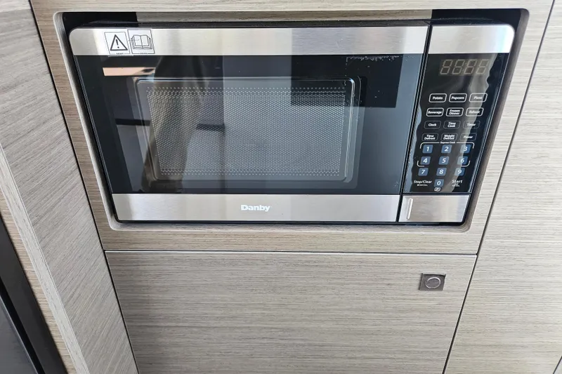 Slide: The Image of Built-in Danby microwave in Jeanneau NC 895 Sport Series 2, 2026 model. - 16