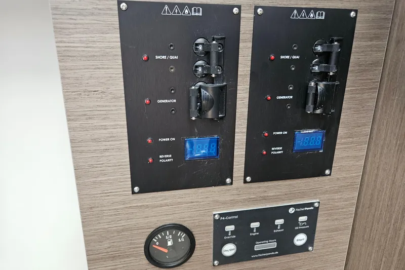 Slide: The Image of Control panel of 2026 Jeanneau NC 895 Sport Series 2 boat, featuring digital displays and switches. - 25