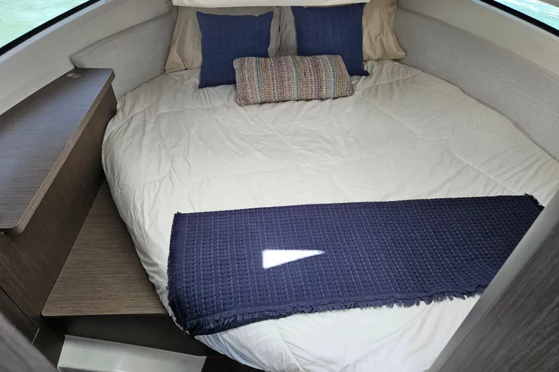 Slide: The Image of Cozy cabin interior of 2026 Jeanneau NC 895 Sport Series 2 with plush bedding. - 26