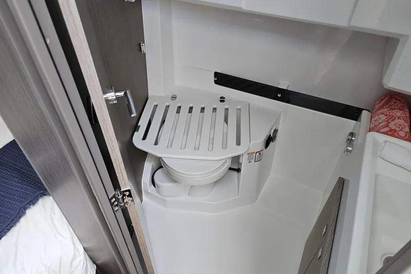 Slide: The Image of Compact bathroom in 2026 Jeanneau NC 895 Sport Series 2 boat, featuring a modern toilet design. - 29