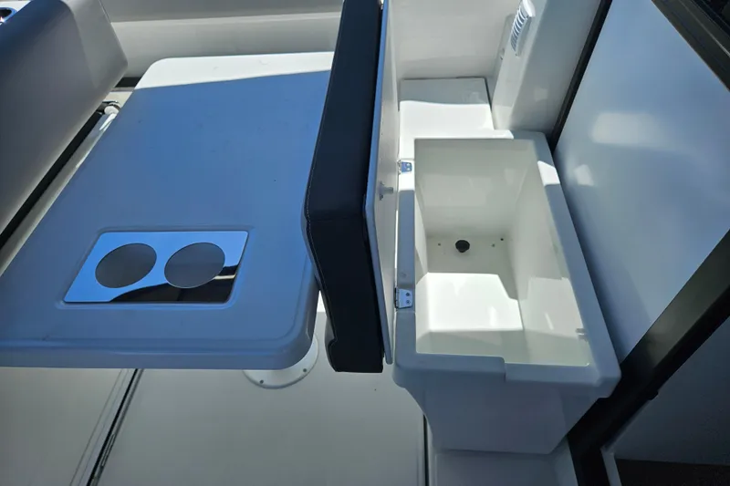 Slide: The Image of 2026 Jeanneau NC 895 Sport Series 2 boat interior with table and storage compartment. - 40