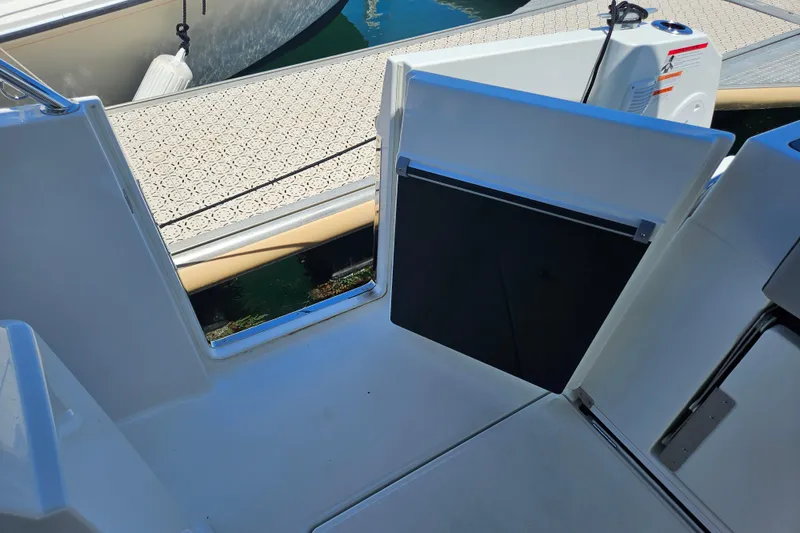 Slide: The Image of Jeanneau NC 895 Sport Series 2, 2026 model, open deck view near dock. - 41