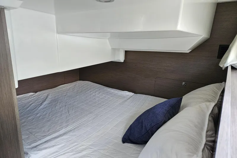 Slide: The Image of Interior cabin of 2026 Jeanneau NC 895 Sport Series 2 with cozy bedding. - 45