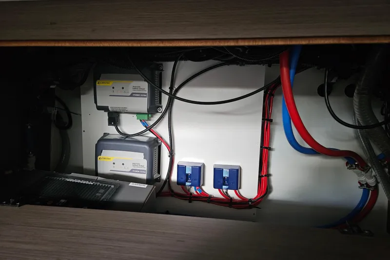 Slide: The Image of Electrical system inside 2026 Jeanneau NC 895 Sport Series 2 boat, featuring wiring and components. - 46