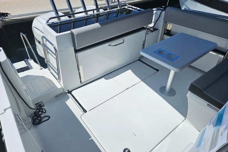 Slide: The Image of Interior of 2026 Jeanneau NC 895 Sport Series 2 boat with seating and table. - 50