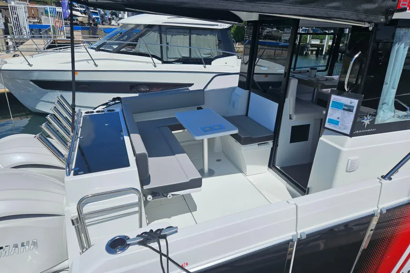 Slide: The Image of 2026 Jeanneau NC 895 Sport Series 2 boat with spacious seating and modern design. - 52