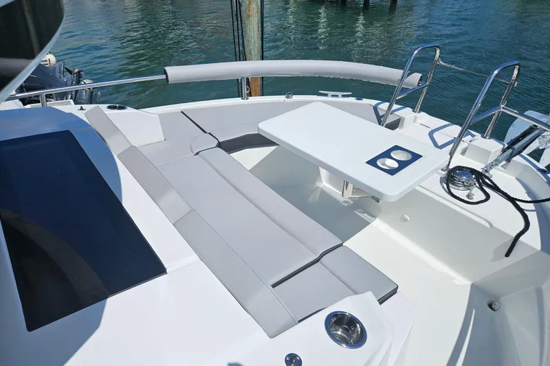 Slide: The Image of 2026 Jeanneau NC 895 Sport Series 2 boat deck with seating and table. - 53