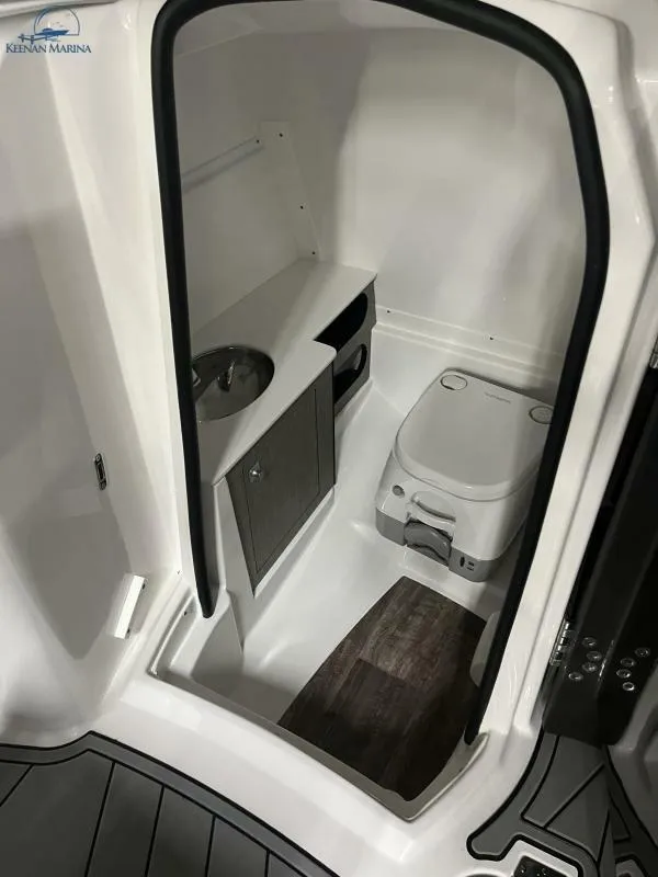 Slide: The Image of 2024 Monterey M6 boat interior with compact bathroom and modern fixtures. - 10