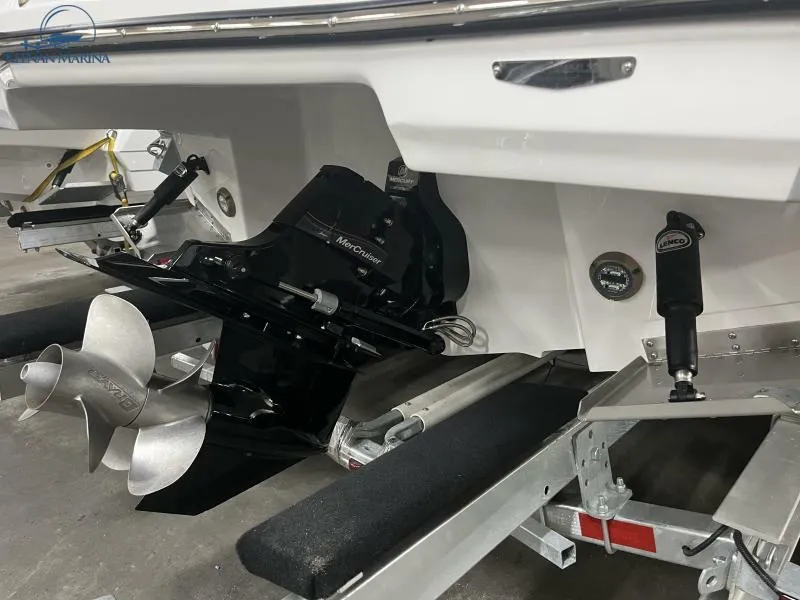 Slide: The Image of 2024 Monterey M6 boat stern with dual propeller and trailer. - 18