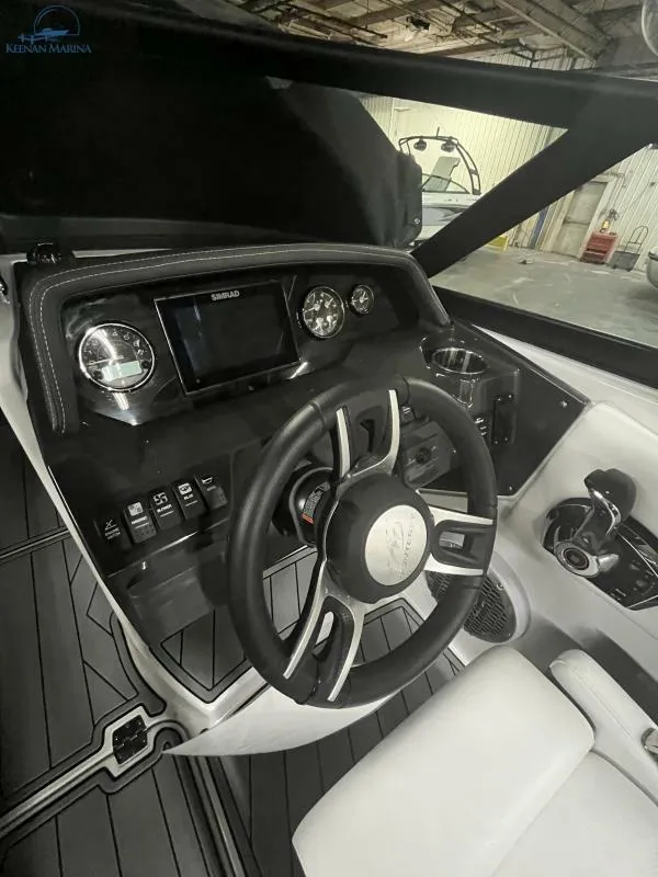 Slide: The Image of 2024 Monterey M6 boat dashboard with steering wheel and control panel. - 8