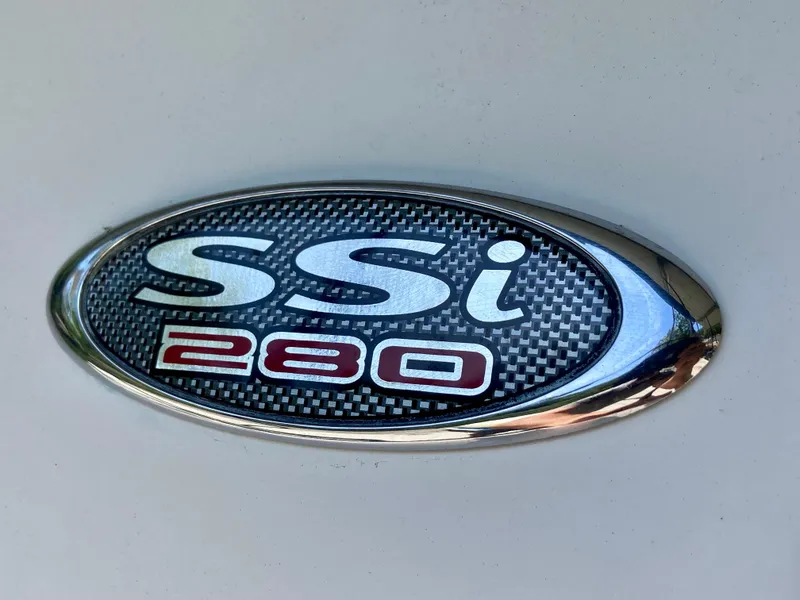Slide: The Image of Chaparral 280 SSi 2000 model emblem with carbon fiber design and chrome trim. - 19
