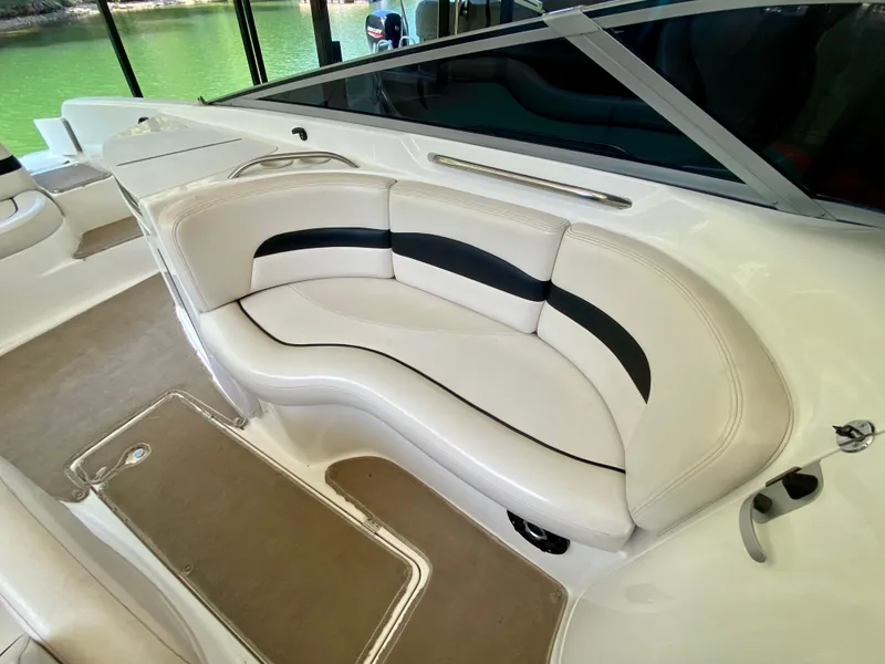 Slide: The Image of 2000 Chaparral 280 SSi boat interior with white and black seating. - 27