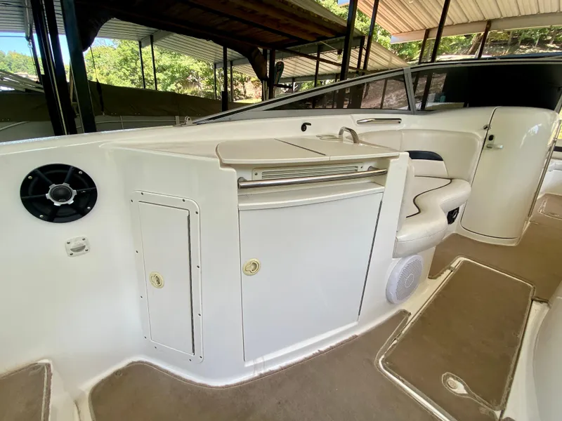 Slide: The Image of 2000 Chaparral 280 SSi boat interior with seating and storage compartments. - 30