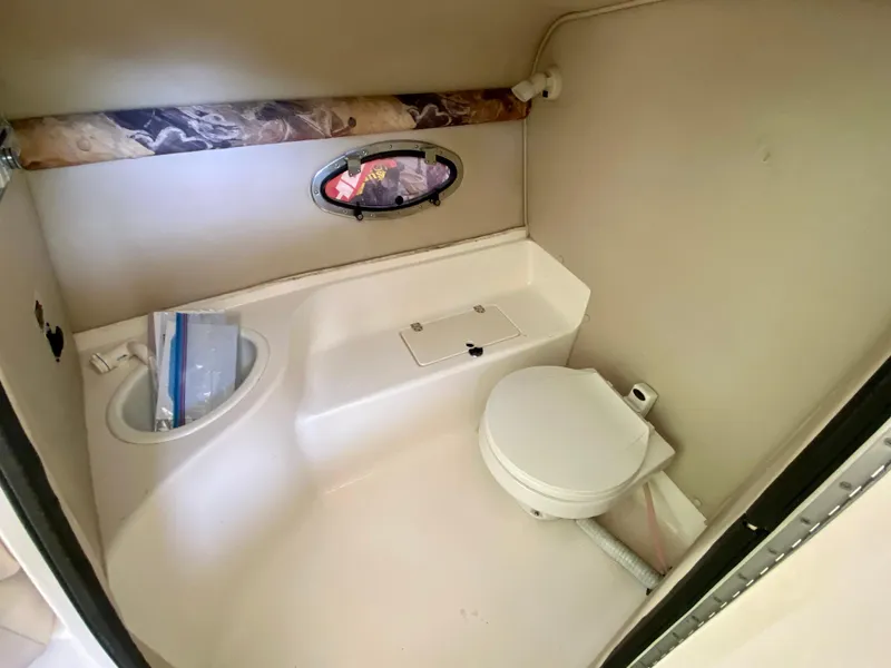 Slide: The Image of 2000 Chaparral 280 SSi boat bathroom interior with toilet and sink. - 35