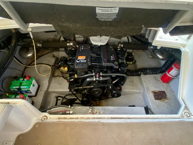 Slide: The Image of Engine compartment of a 2000 Chaparral 280 SSi boat, featuring a V8 engine. - 36