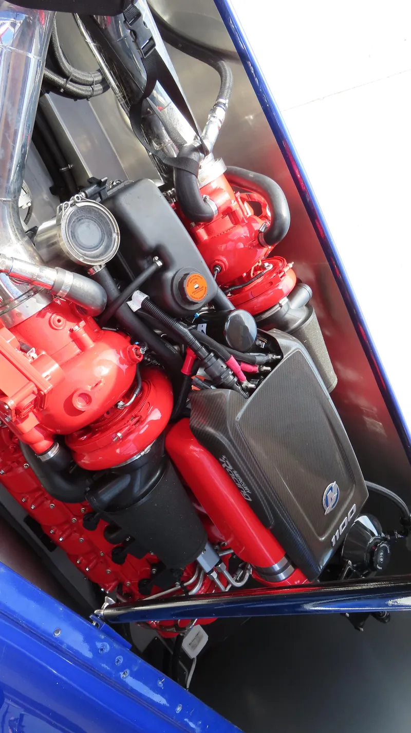 Slide: The Image of Engine of 2007 Mystic Powerboats 50', featuring red components and sleek design. - 27