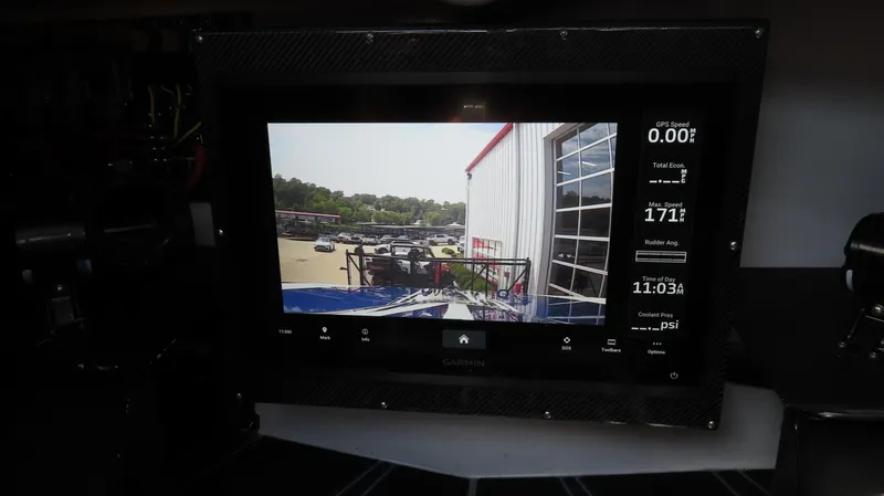 Slide: The Image of Dashboard display of a 2007 Mystic Powerboats 50' showing navigation and performance data. - 30