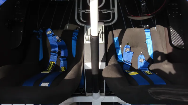 Slide: The Image of Interior of 2007 Mystic Powerboats 50' with blue racing seats and harnesses. - 34