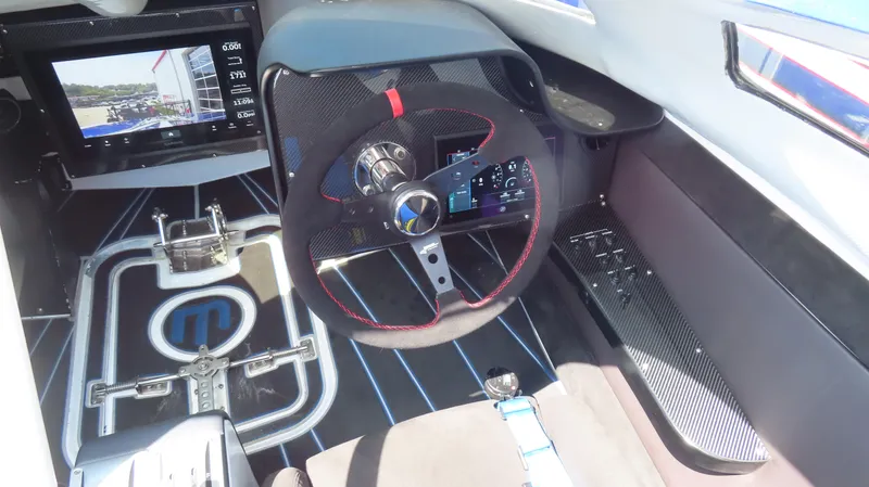 Slide: The Image of Cockpit of 2007 Mystic Powerboats 50' with modern steering and control panel. - 35