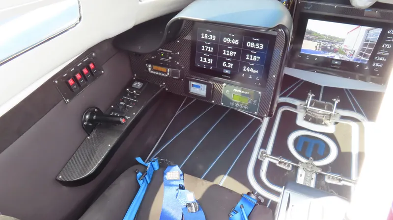 Slide: The Image of Interior cockpit of a 2007 Mystic Powerboats 50' with digital displays and controls. - 36