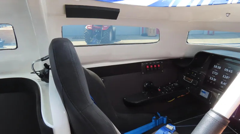 Slide: The Image of Interior cockpit of a 2007 Mystic Powerboats 50' with control panel and seating. - 8