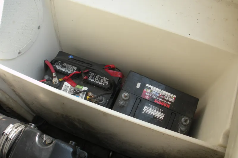 Slide: The Image of Battery compartment of a 1999 Rinker 232 Captiva Cuddy boat. - 18