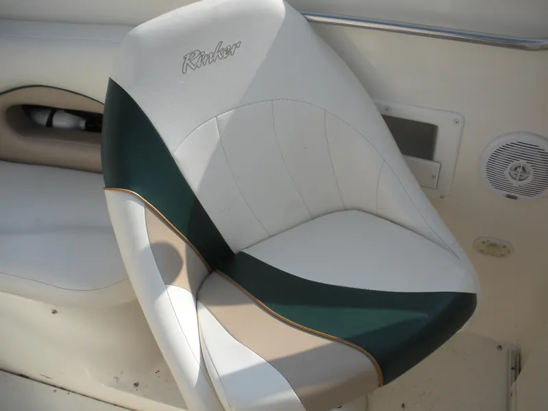 Slide: The Image of 1999 Rinker 232 Captiva Cuddy boat on trailer, parked outdoors. - 4