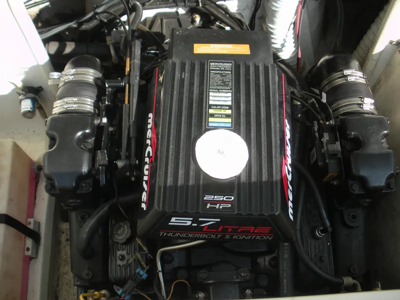 Slide: The Image of 1999 Rinker 232 Captiva Cuddy boat deck with hatch, viewed from cockpit. - 6