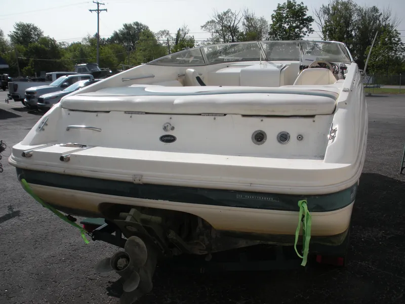 Slide: The Image of 1999 Rinker 232 Captiva Cuddy dashboard with steering wheel and Lowrance device. - 9