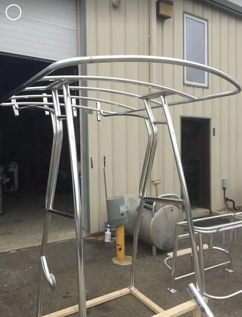 Slide: The Image of Stainless steel T-top frame for 1991 Mako 241 boat outside a workshop. - 23