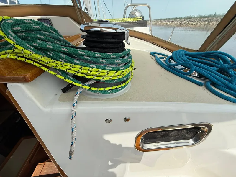 Slide: The Image of Sailboat deck with colorful ropes and winch, Tartan 4000, 2012 model. - 16