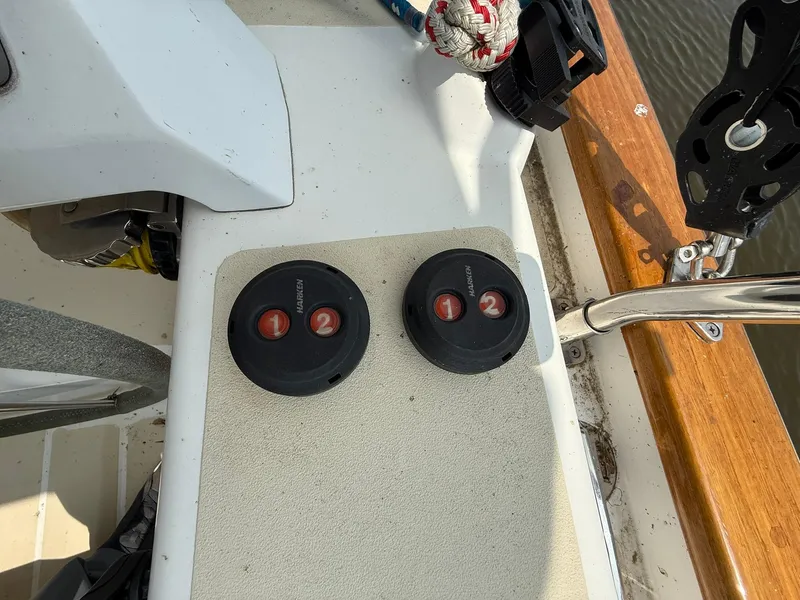 Slide: The Image of Control panel on a 2012 Tartan 4000 sailboat deck with two circular switches. - 19