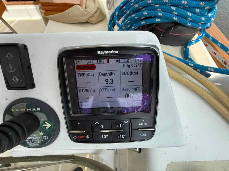 Slide: The Image of Raymarine navigation display on Tartan 4000 yacht, showing depth and heading, with ropes in the background. - 21