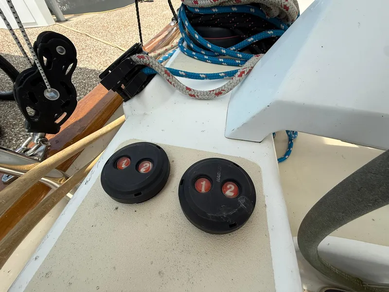 Slide: The Image of Sailboat deck controls on a 2012 Tartan 4000, featuring ropes and pulleys. - 27